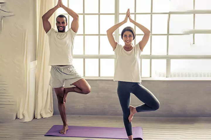 Couple practicing yoga together