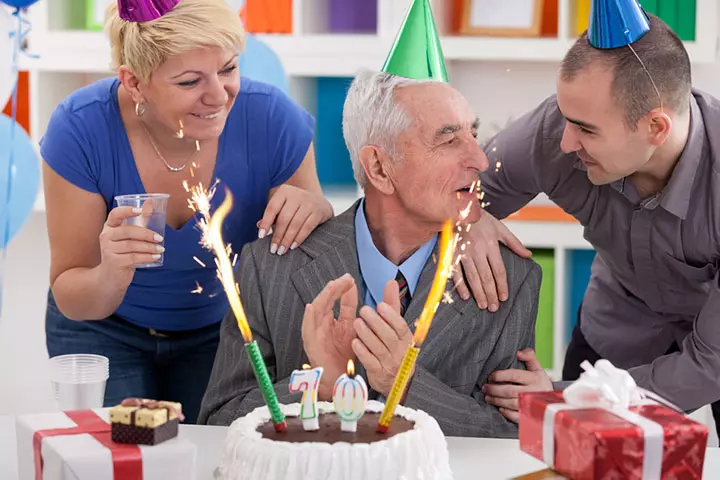 Father celebrating birthday with son and daughter