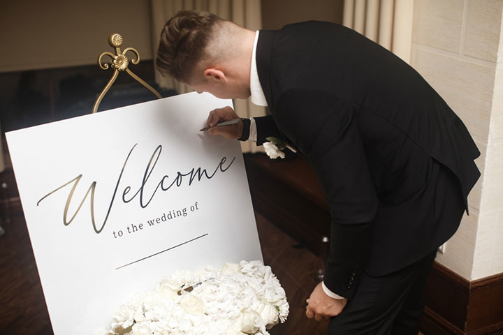 Groom is writing a special letter on his wedding day