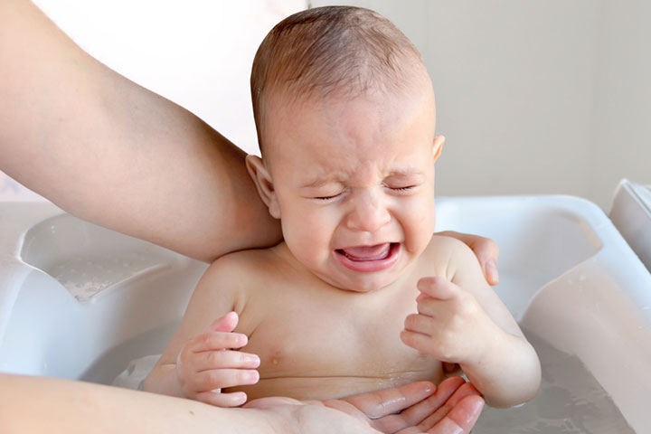 If the baby looks uneasy or uncomfortable, remove them from the bathtub.