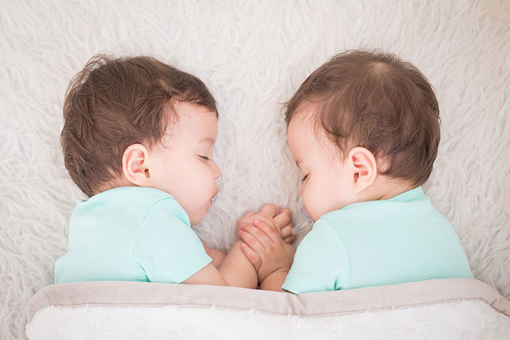 Twin babies shake heads quite often when sleeping 