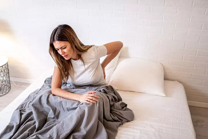 A back pain may indicate you are pregnant