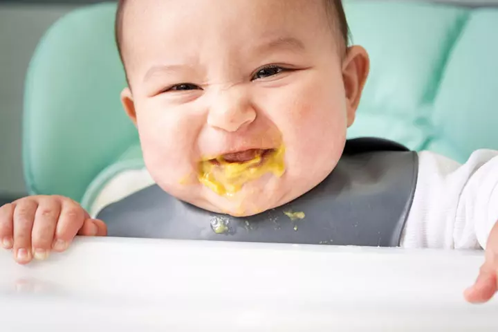 A bottle-fed baby spits up often