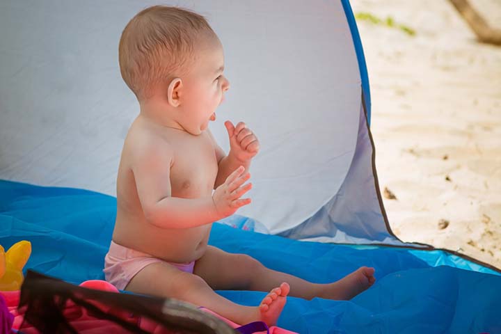 A tent at the beach can help protect the baby from direct sunlight