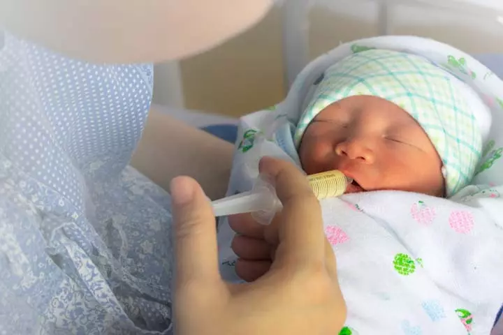 Hold the baby securely when feeding with a syringe