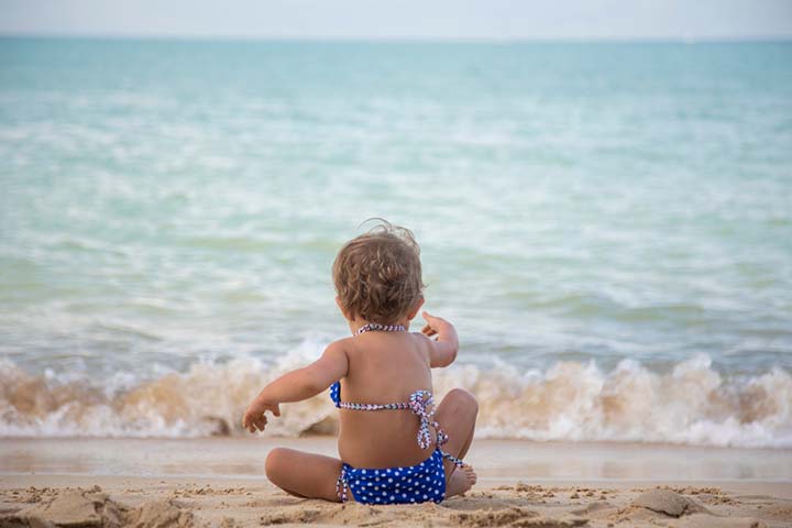 Keep the baby at a safe distance from water when at the beach