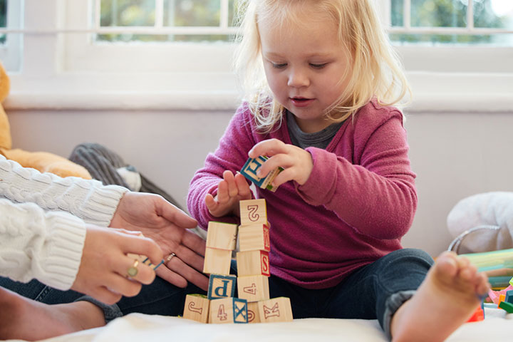 Practice stacking with wooden blocks