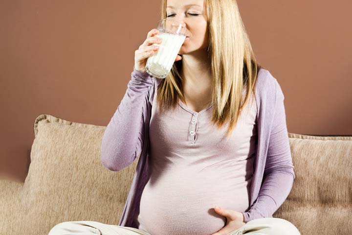 Pregnant woman eating light dinner