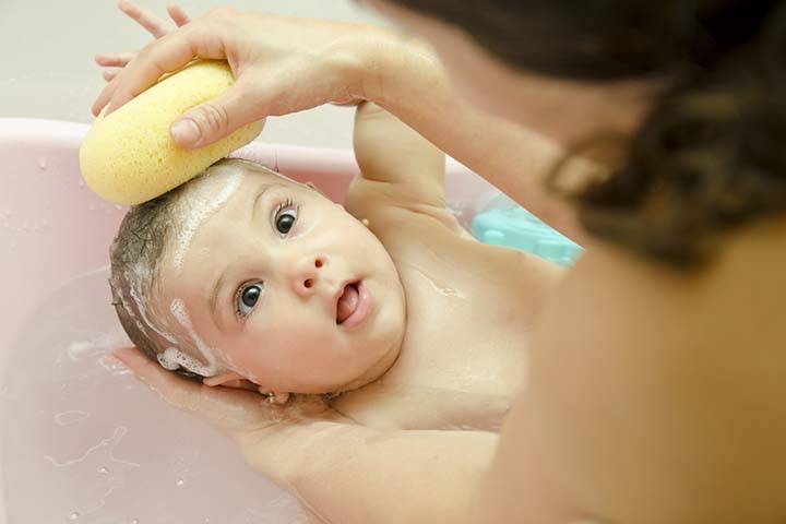 Showering with a baby may make holding them difficult.