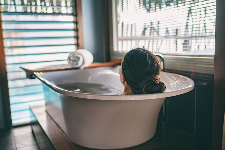Soak yourself in a bathtub to reduce swelling and pain.