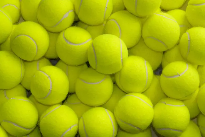 Tennis balls are usually of bright colors like green or neon yellow