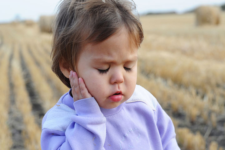 Toddlers may point at their ears to indicate an issue