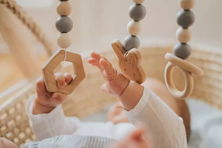 When babies learn to grab things, they may stay up late practicing the new-found skill.