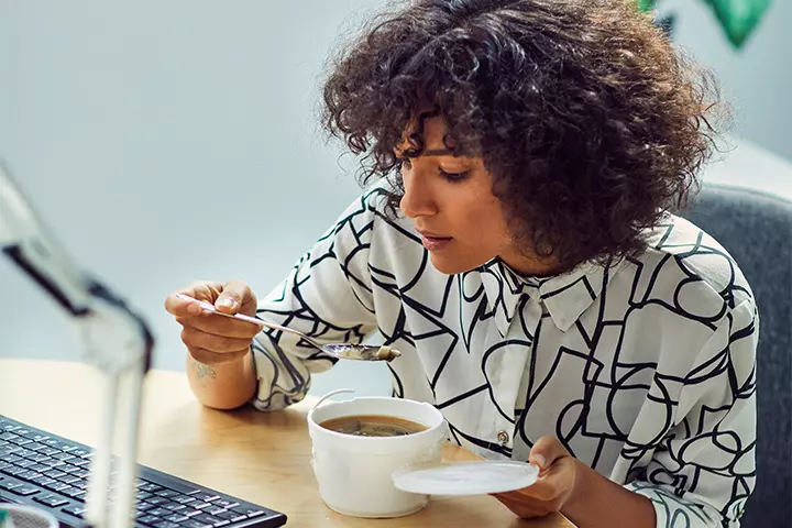 Woman enjoying food sent by partner