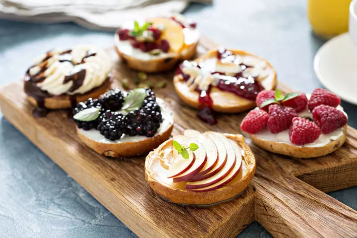 spread a spoonful of butter on a bagel or bread toast