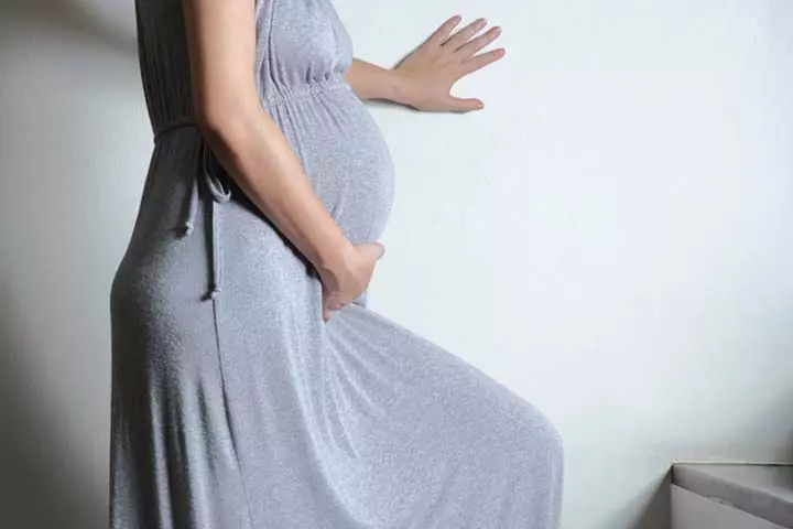 Pregnant woman climbing stairs