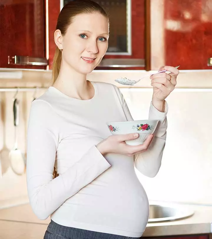 A Pregnant Woman Eating Sour Cream