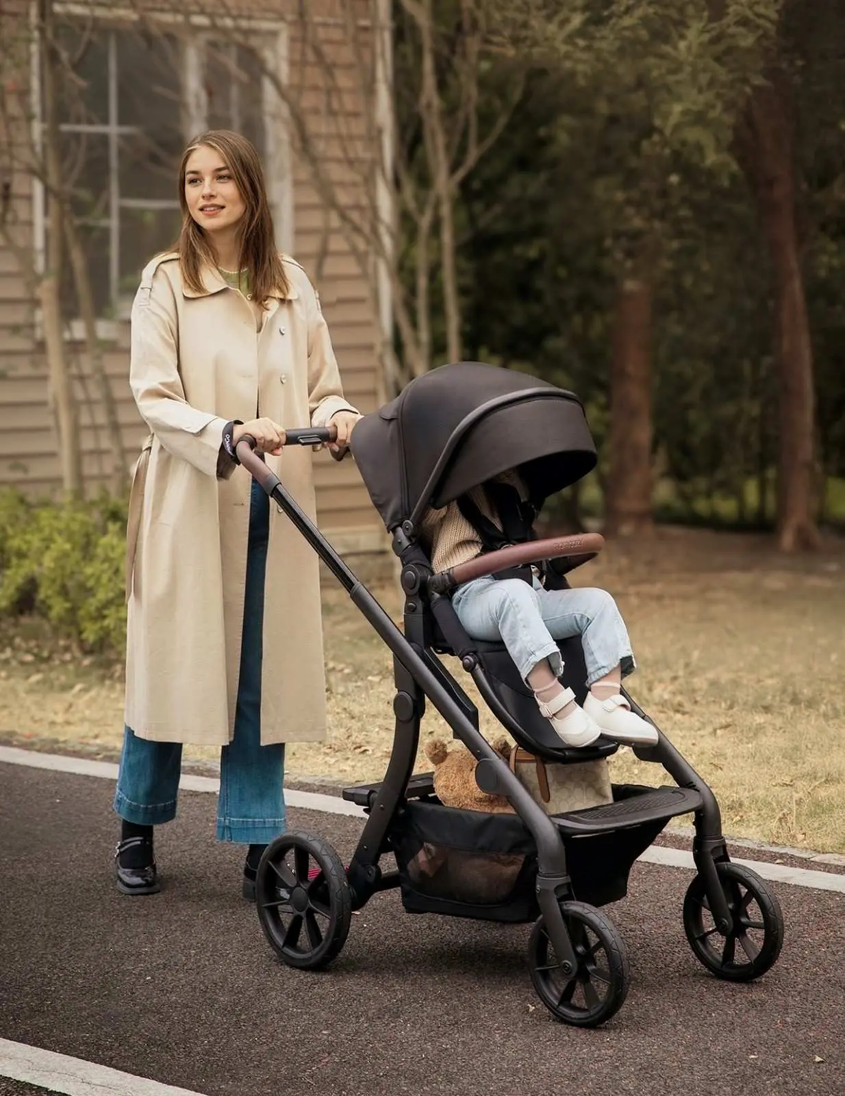 A woman and her toddler on an outdoor adventure with the Momcozy ChangeGo Stroller.