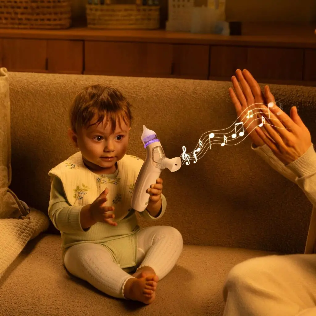 A happy baby enjoying the calming music from the Momcozy Electric Nasal Aspirator